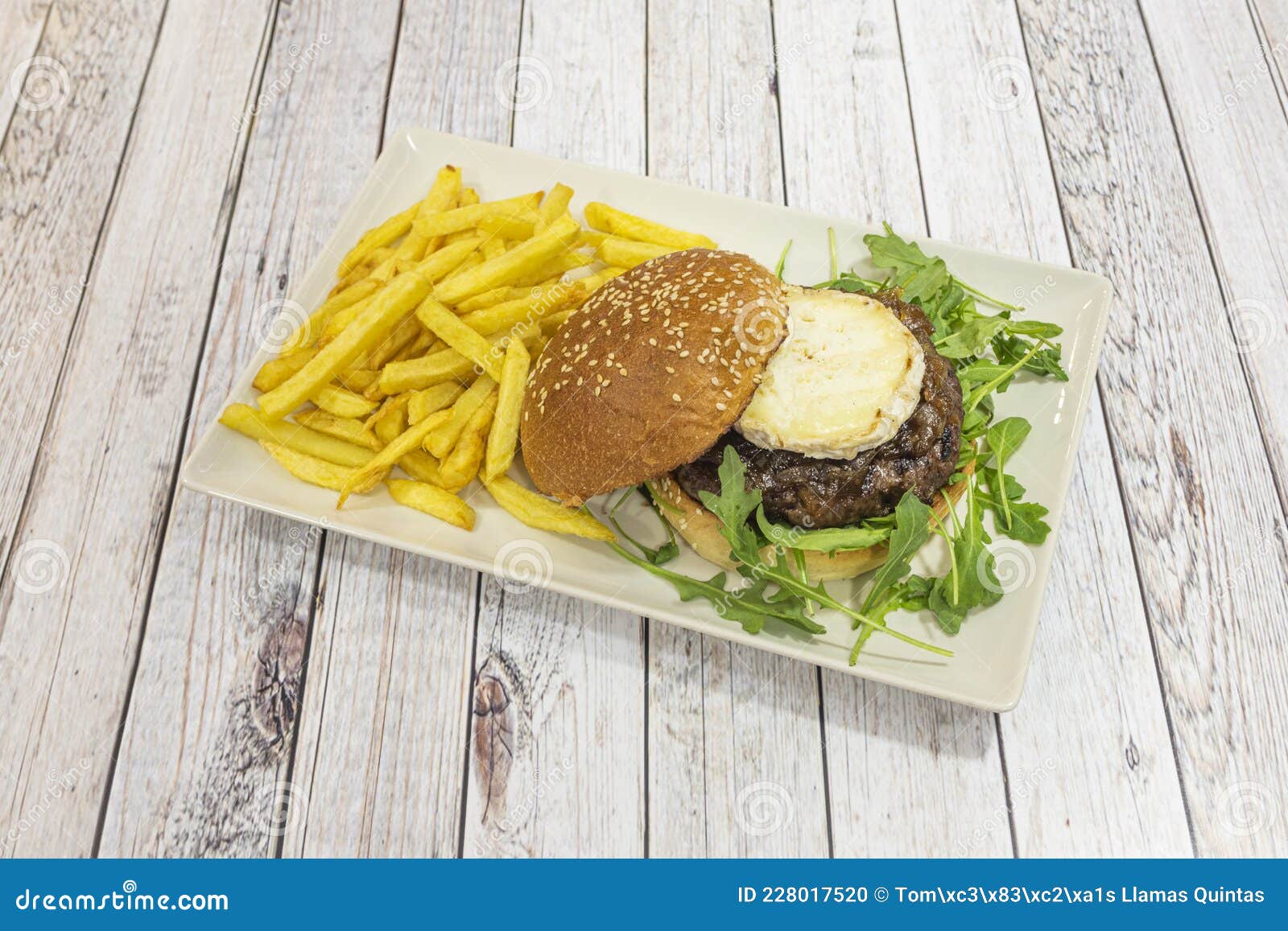 Beef Burger with Onion Jam, Slice of Goat Cheese, Arugula Stock Photo