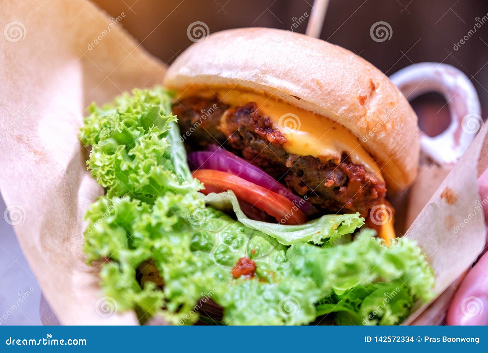 A Beef Cheeseburger in Restaurant Stock Photo - Image of bowl, burger ...