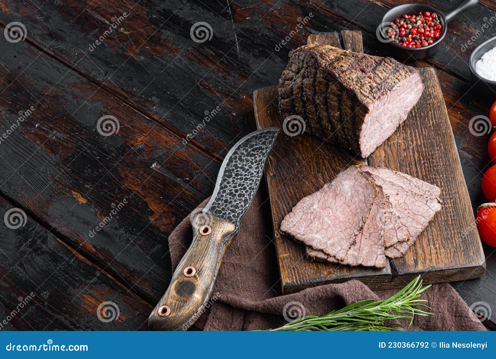 Beef Cold Meat Cut, on Wooden Cutting Board, on Old Dark Wooden Table