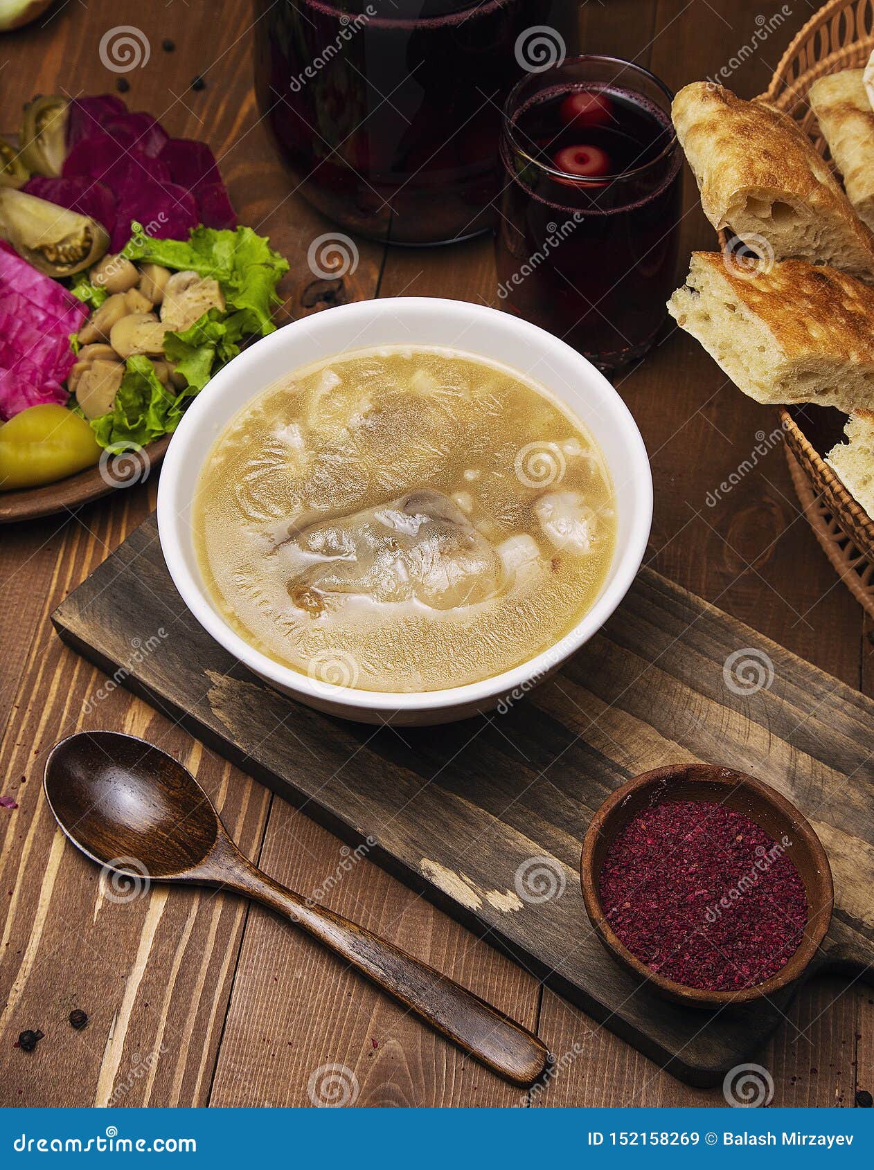 beef, lamb broth soup with tomato sauce and onions, sumakh.