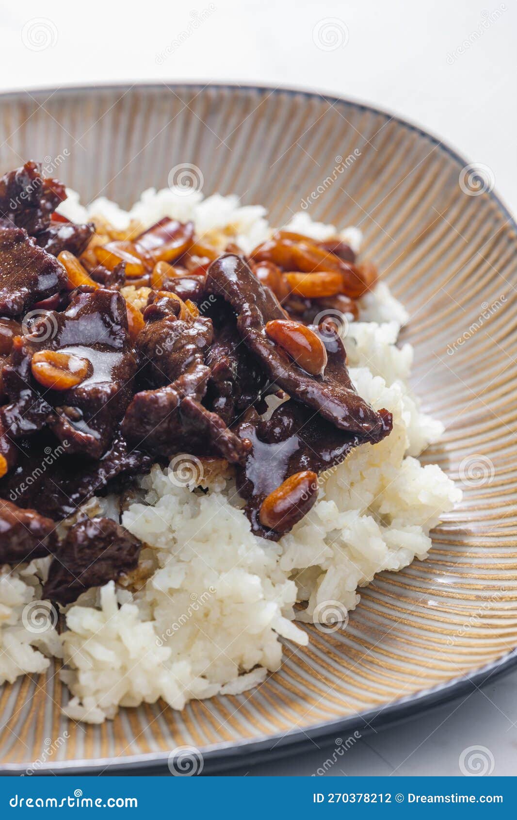 Beef Meat with Soya Sauce and Peanuts Served with White Rice Stock