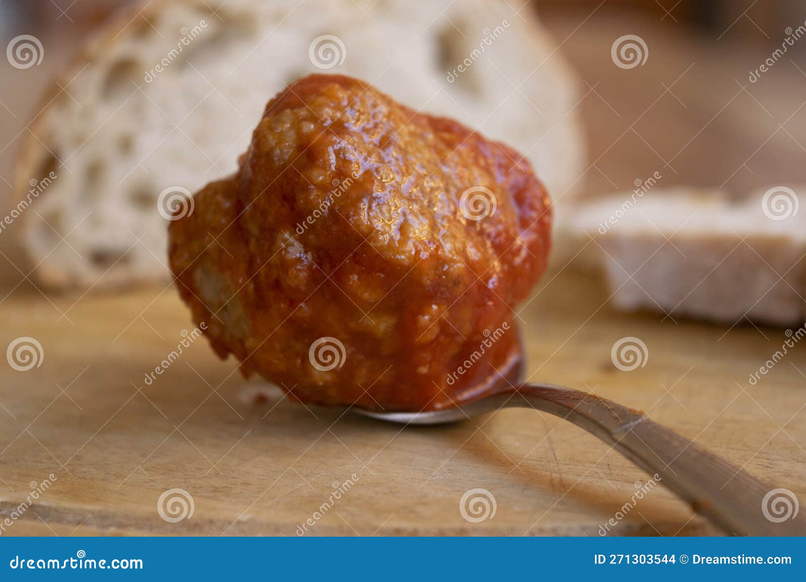 Beef meatball on a spoon stock photo. Image of sauce 271303544