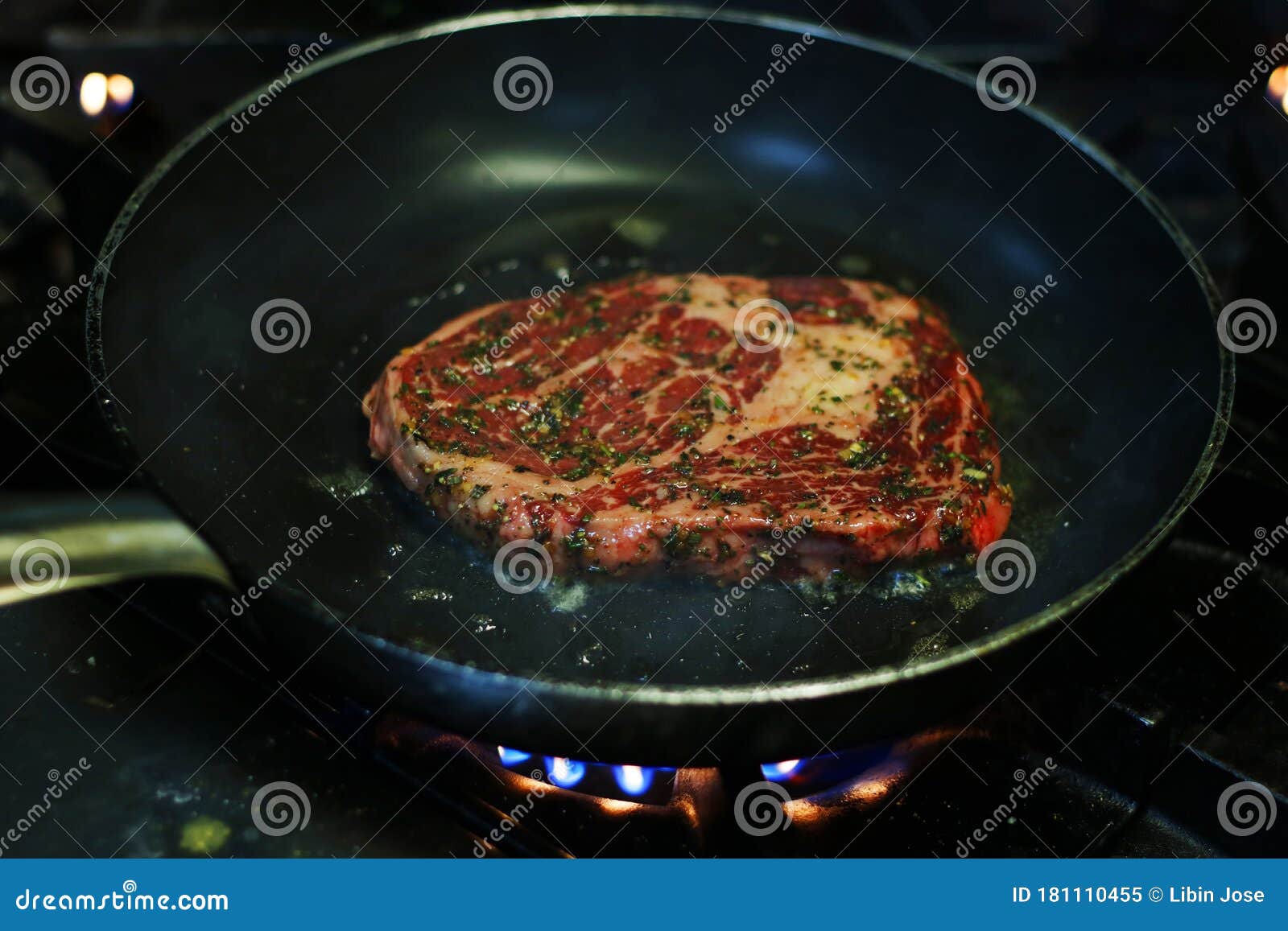 https://thumbs.dreamstime.com/z/beef-ribeye-steak-cooking-hot-non-stick-pan-181110455.jpg