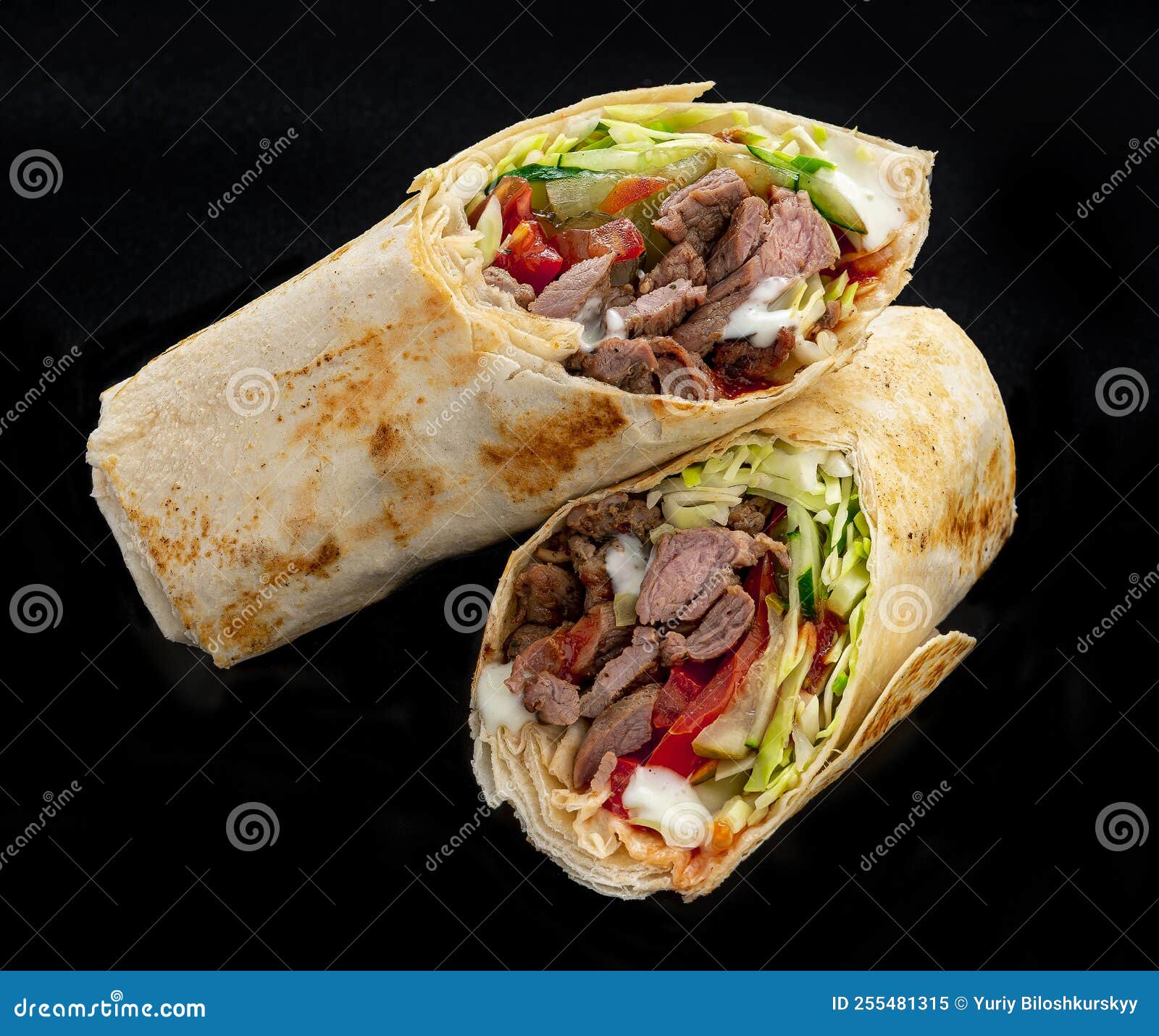 Beef Shawarma on a Dark Background. Shawarma with Beef in Pita Bread