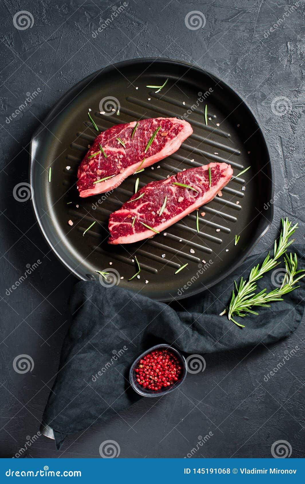 Beef Sirloin Steak on the Grill Pan. Black Background, Top View. Stock