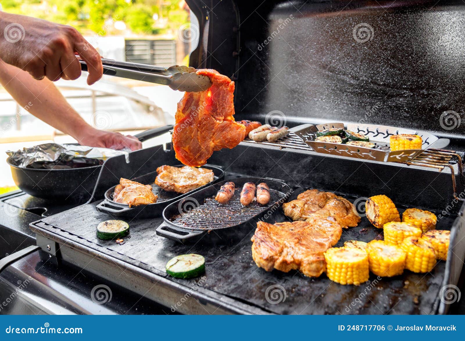 Beef Steak and Grill Barbecue Outdoors on the Backyard. Bbq Party Stock