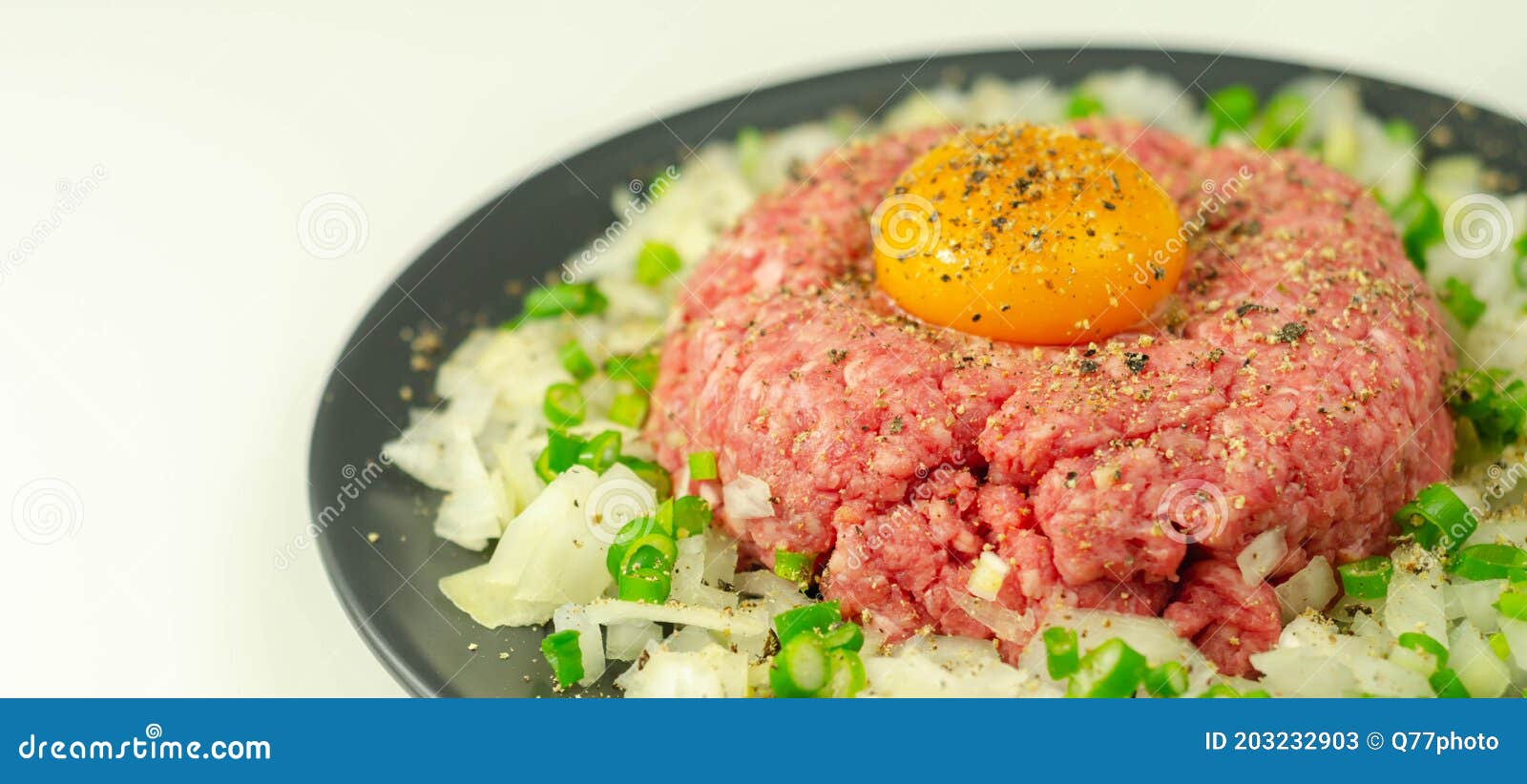 Beef Steak Tartare with Raw Egg Yolk and Onion with Chive Stock Image