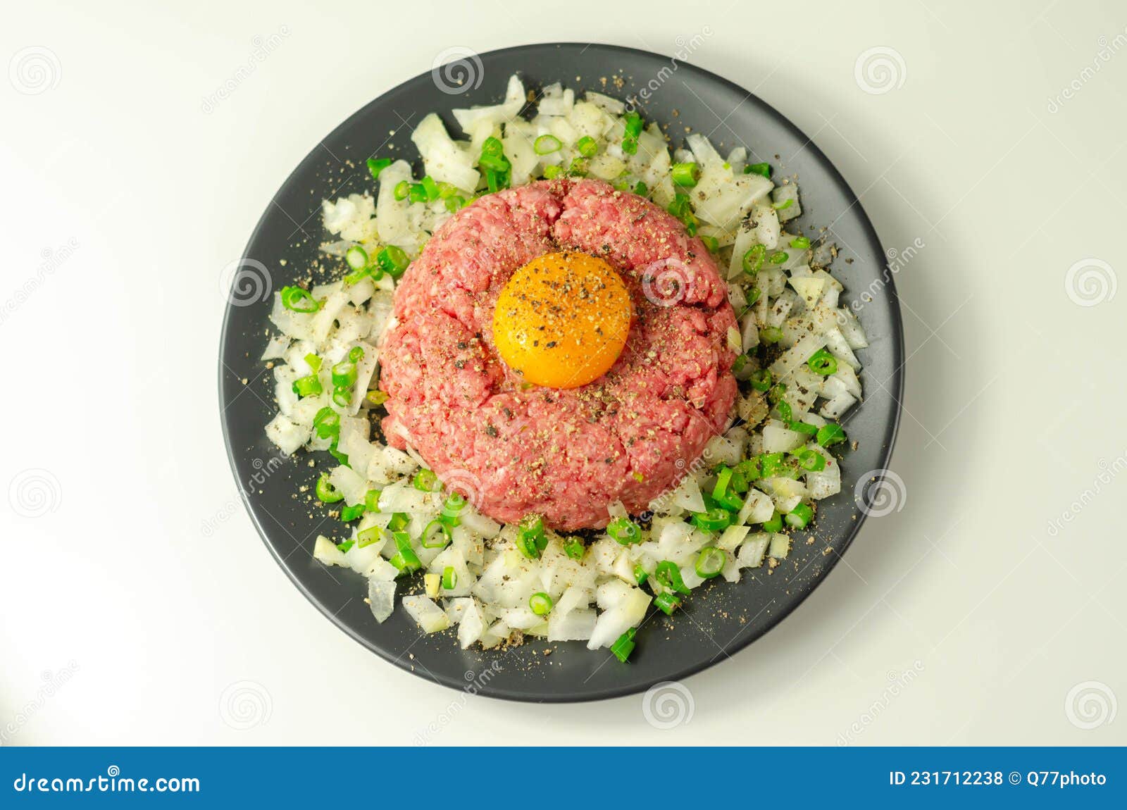 Beef Steak Tartare with Raw Egg Yolk and Onion with Chive Stock Photo