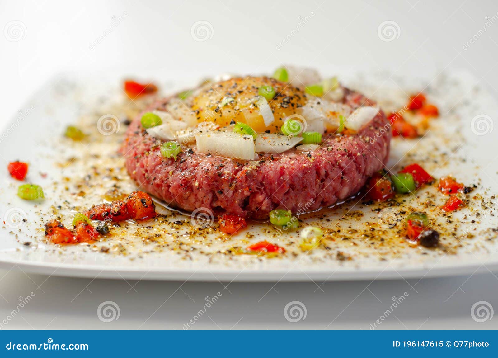 Beef Steak Tartare with Raw Egg Yolk and Onion with Tomato Stock Image