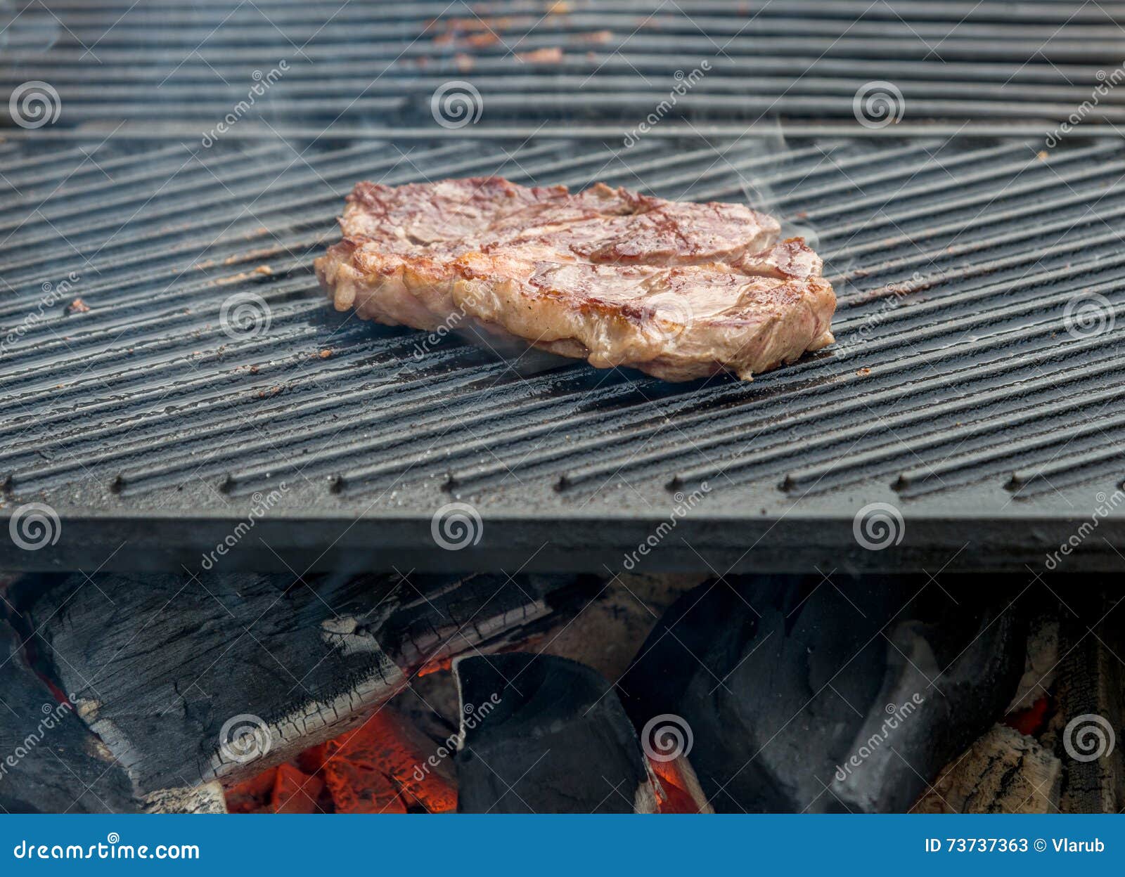 Beef steaks on the grill stock image. Image of cooking 73737363