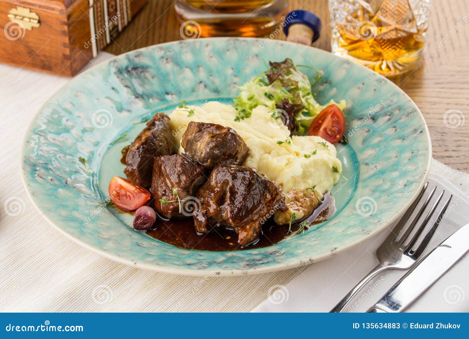 beef-stew-with-mashed-potatoes-and-fresh-vegetables-on-wooden-table