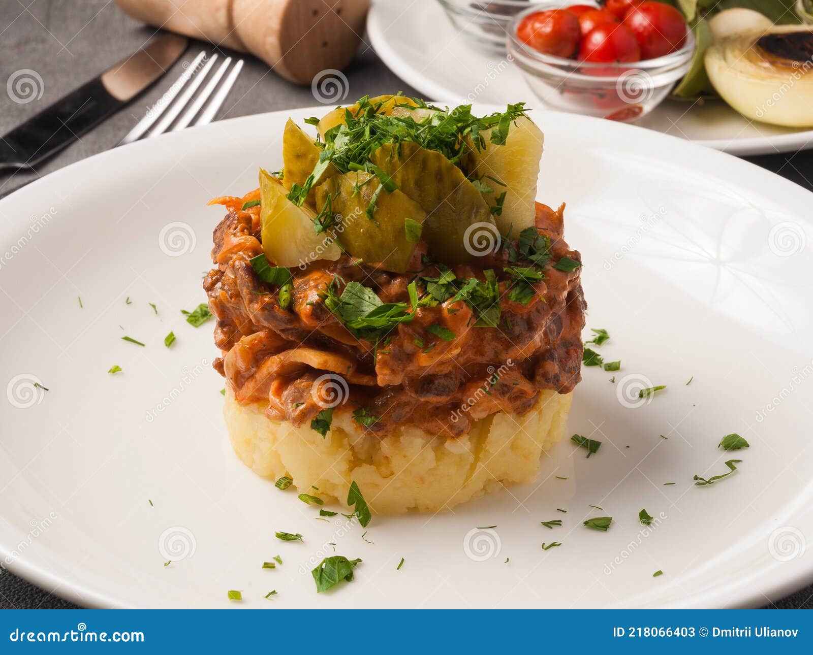 Beef Stroganoff with Mashed Potatoes and Pickles on a White Plate Stock