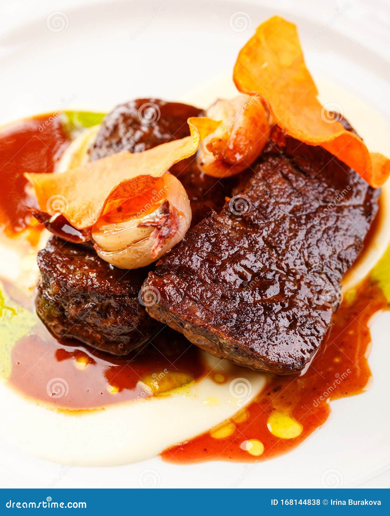 Beef Tenderloin Medallions with Sauce and Onion Stock Photo - Image of