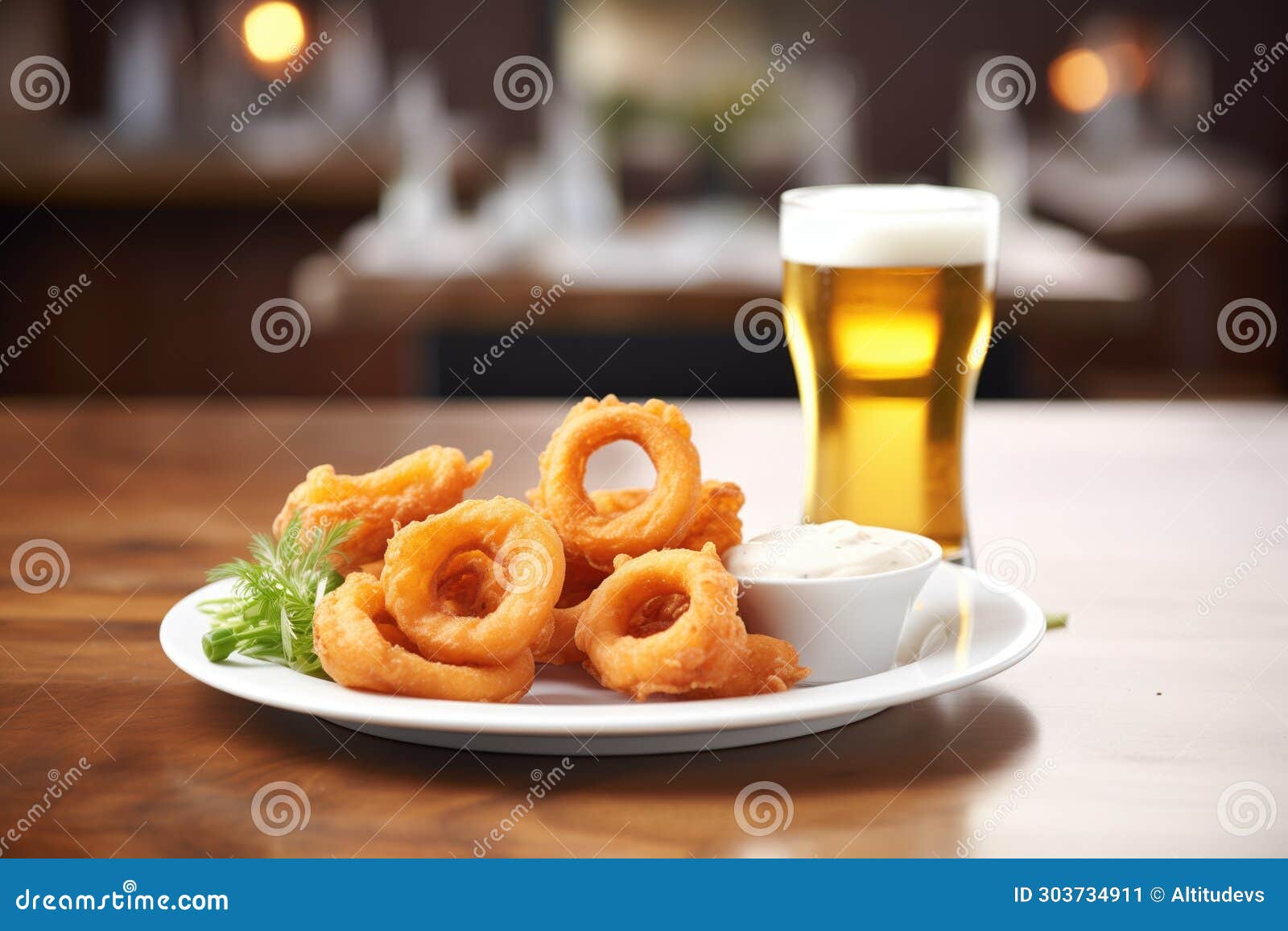 beer-battered onion rings with a pint of beer