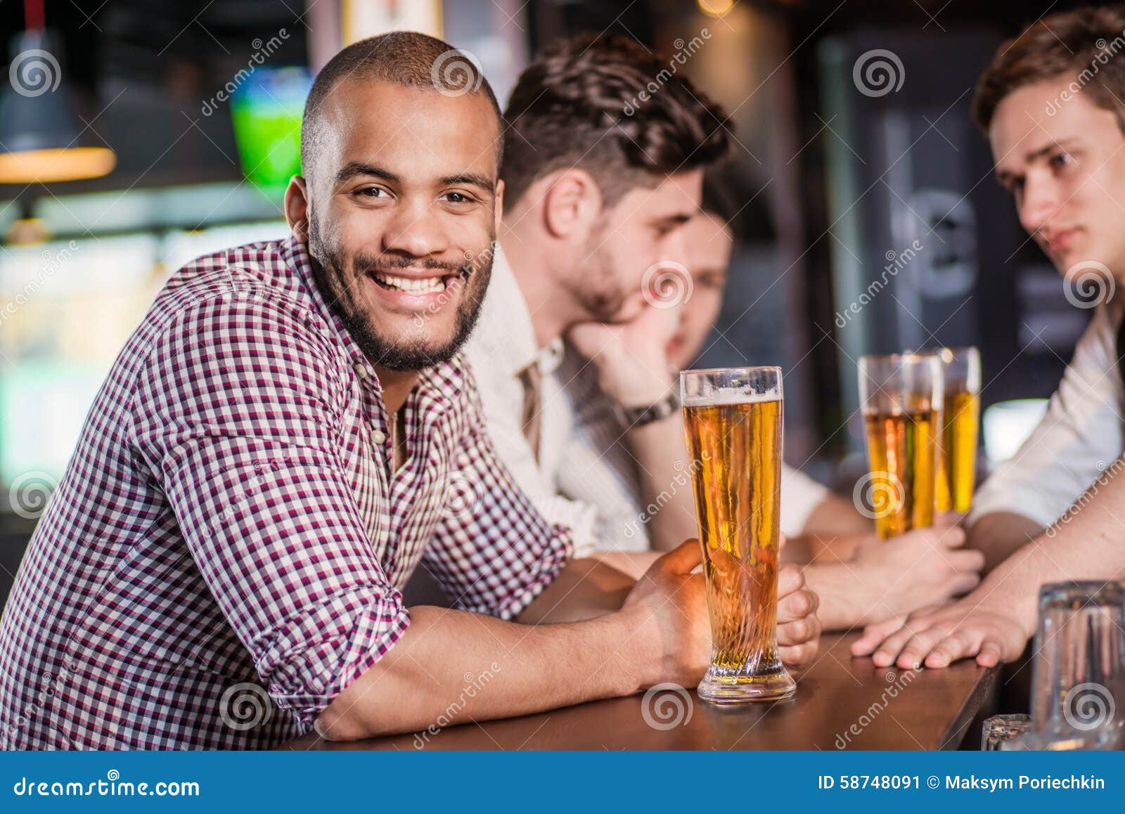 Beer is the Best Drink for Men. Three Other Men Drinking Beer an Stock