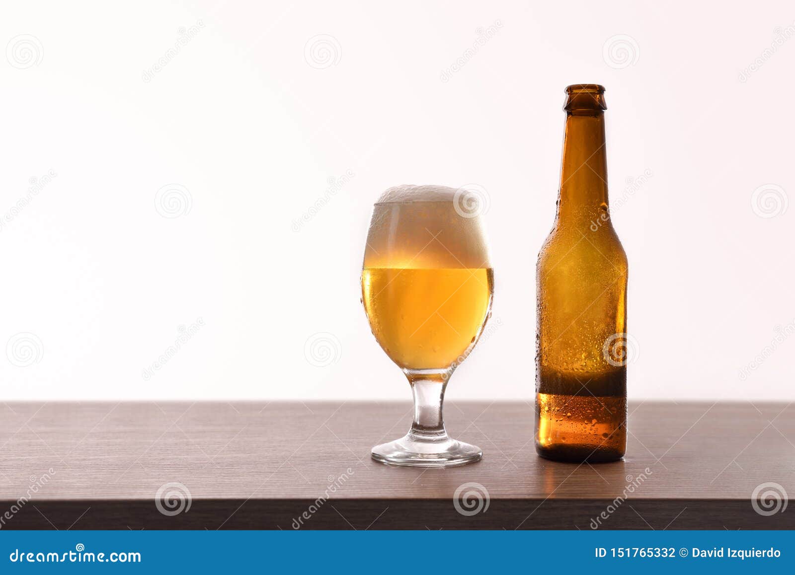 Beer Bottle and Glass Cup on Table Isolated White Stock Photo Image