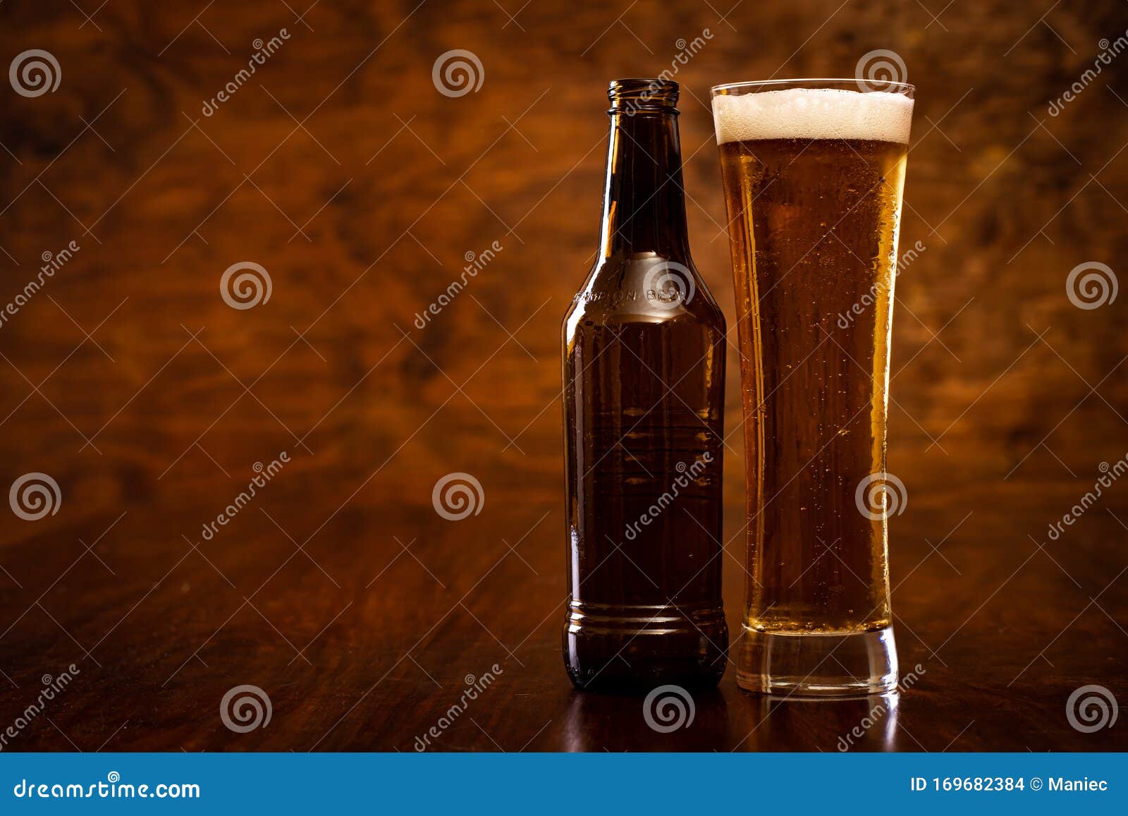 Beer bottle and a glass. stock photo. Image of drink 169682384