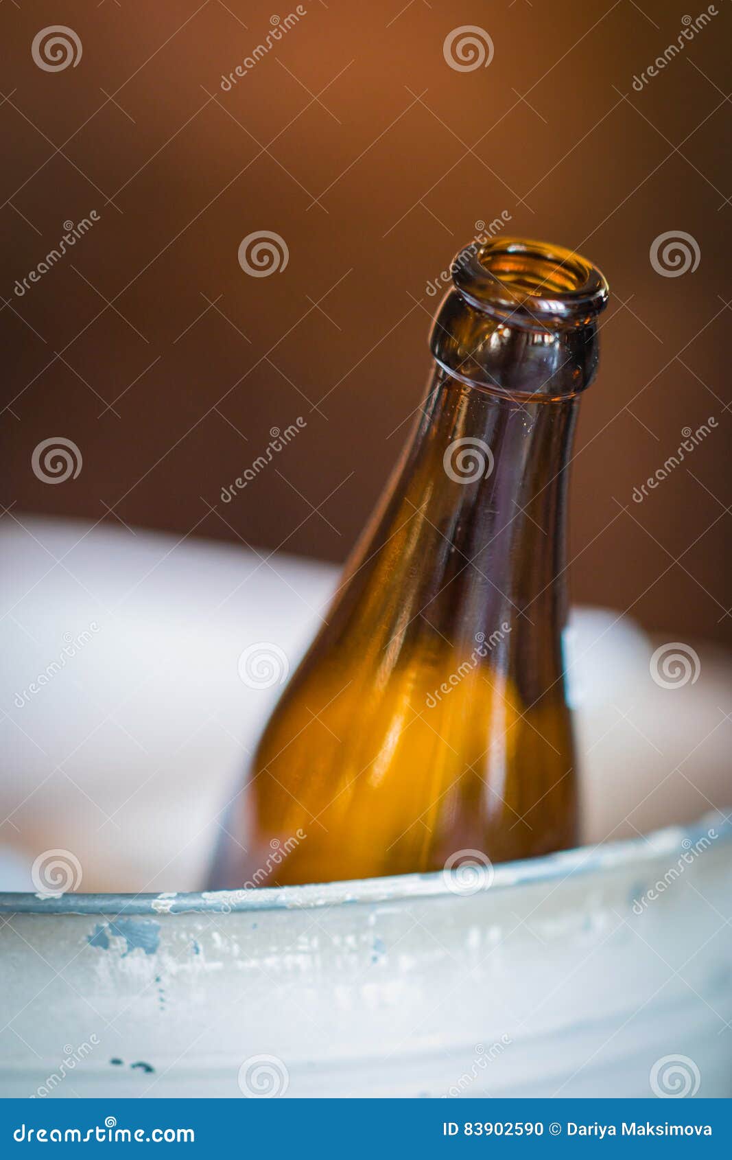 Beer Bottle In Metal Bucket On Blurry Background Stock ...