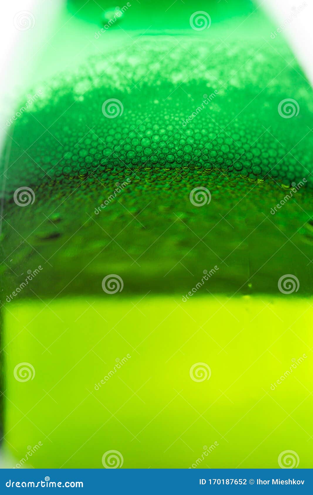 Beer with Bubbles and Foam in a Green Bottle Stock Photo Image of