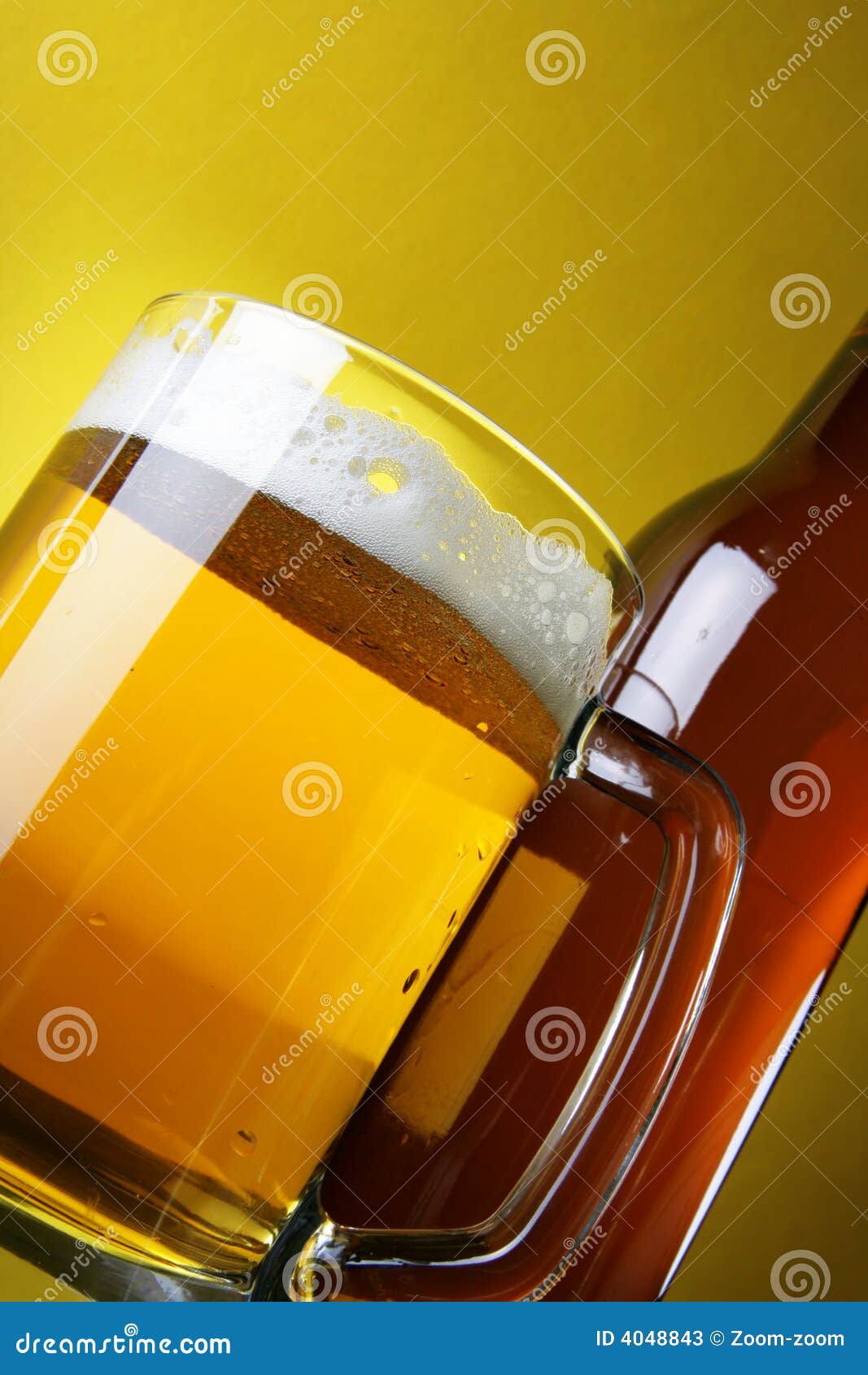 beer with froth and bottle