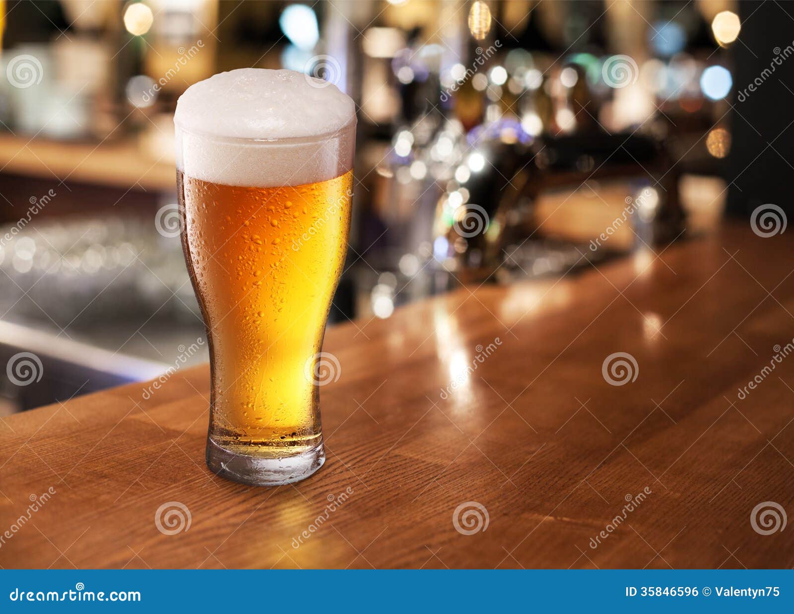 Beer glass on a bar. stock photo. Image of beverage, foam 35846596