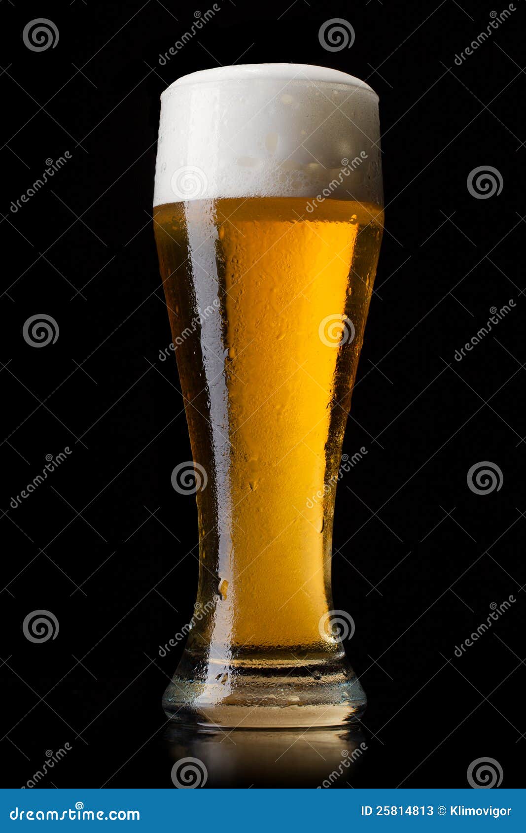 Beer into glass on a black stock image. Image of bottle 25814813