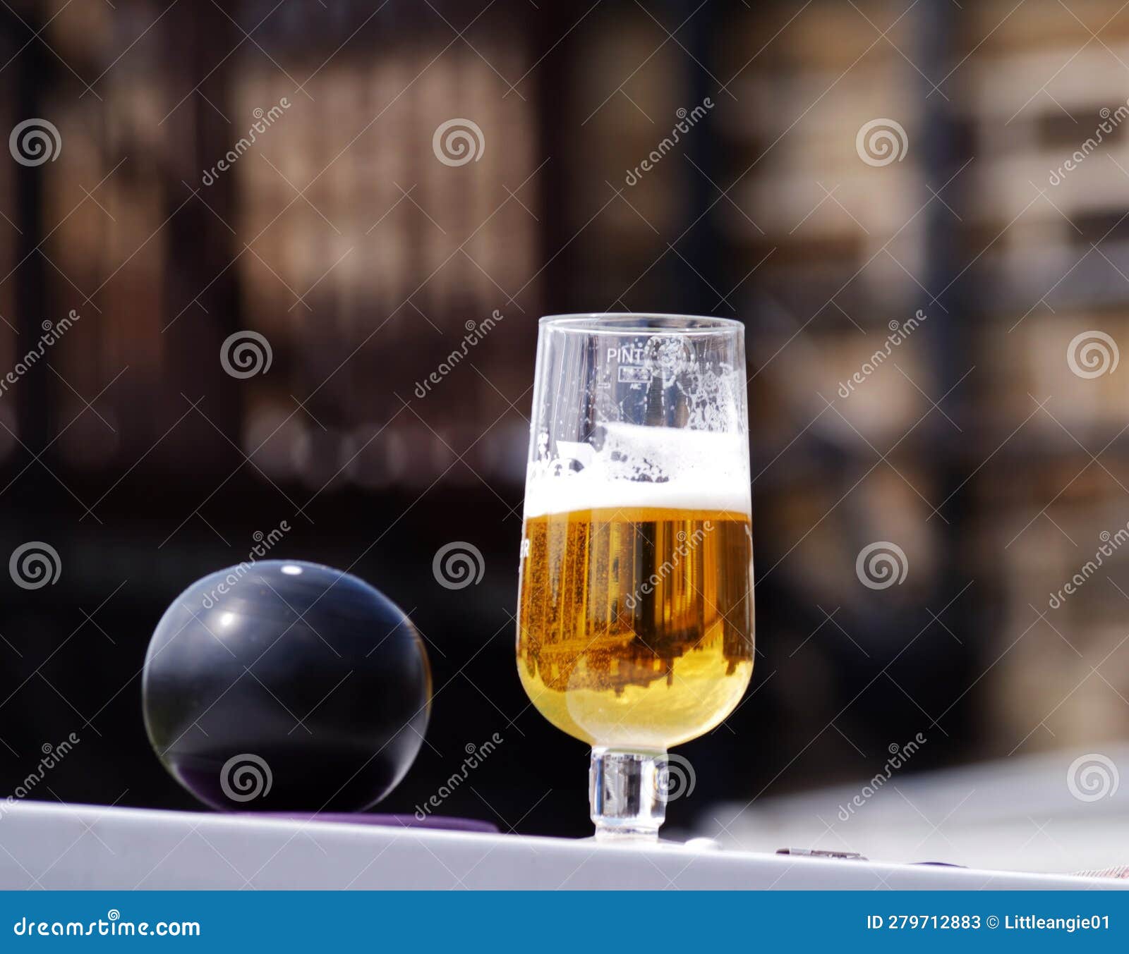 Beer in Plastic Beaker and Bowling Ball at Sports Event Stock Image