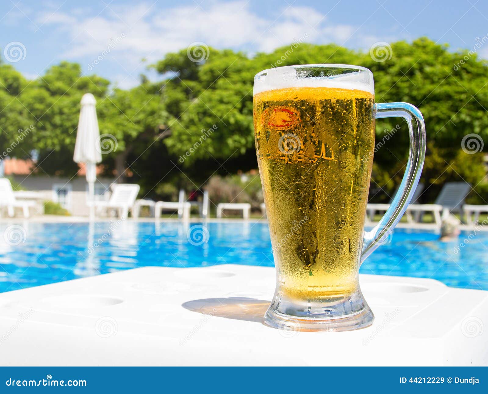 Beer by the pool stock image. Image of background, blue 44212229