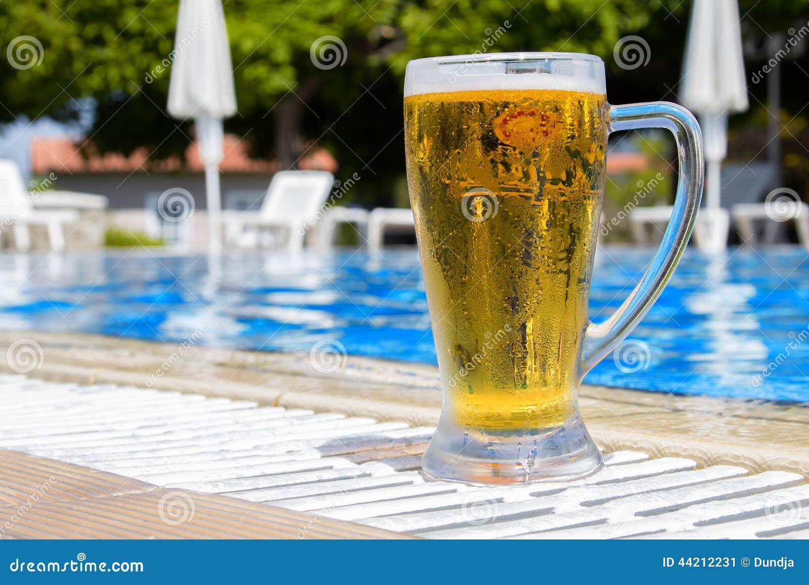 Beer by the pool stock image. Image of summer, beverage 44212231