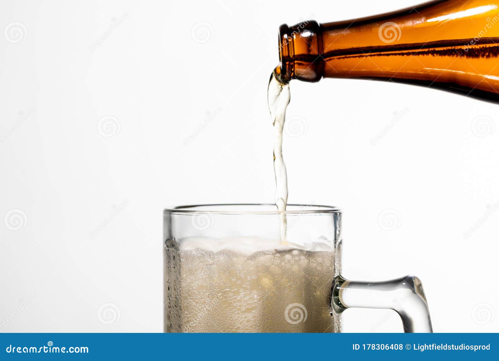 Pouring from Bottle into Glass with Stock Photo Image of glass
