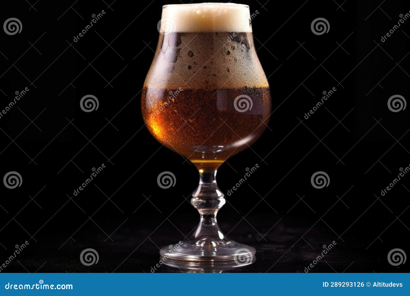 Beer Snifter Glass with Condensation on Dark Background Stock Photo