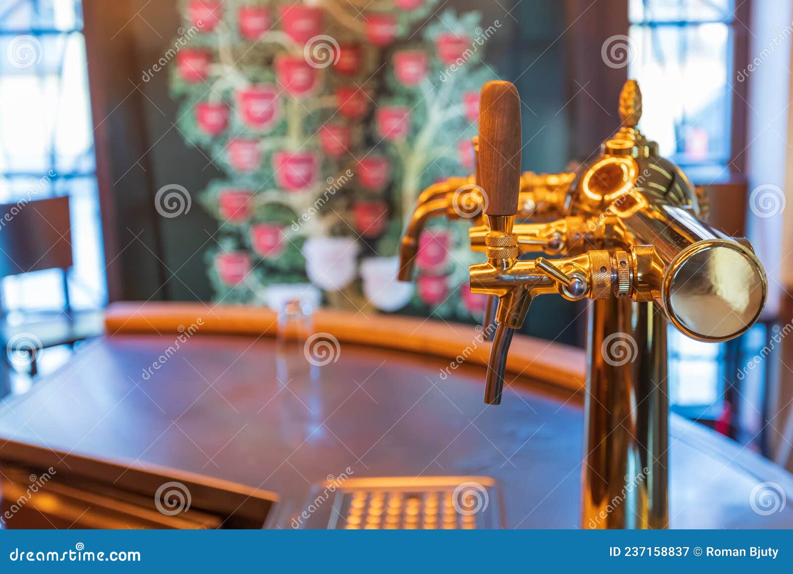 Beer Tapping Equipment in a Restaurant. the Background is Blurred Stock