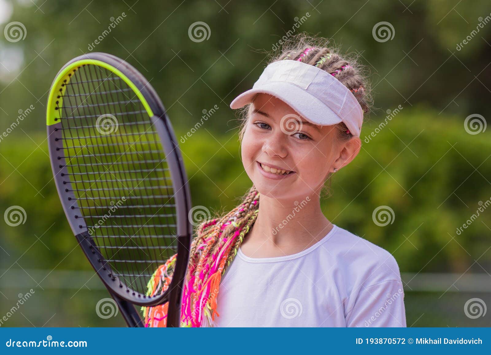 Beginner Girl Tennis Player with a Tennis Racket in Her Hands. Stock