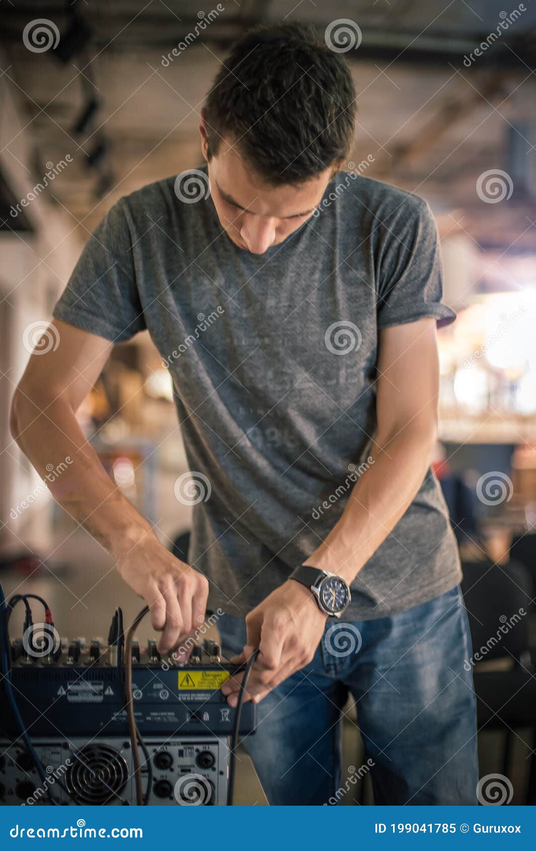 Behind the Scene. Sound Technician Electric Engineer Adjusting Sound