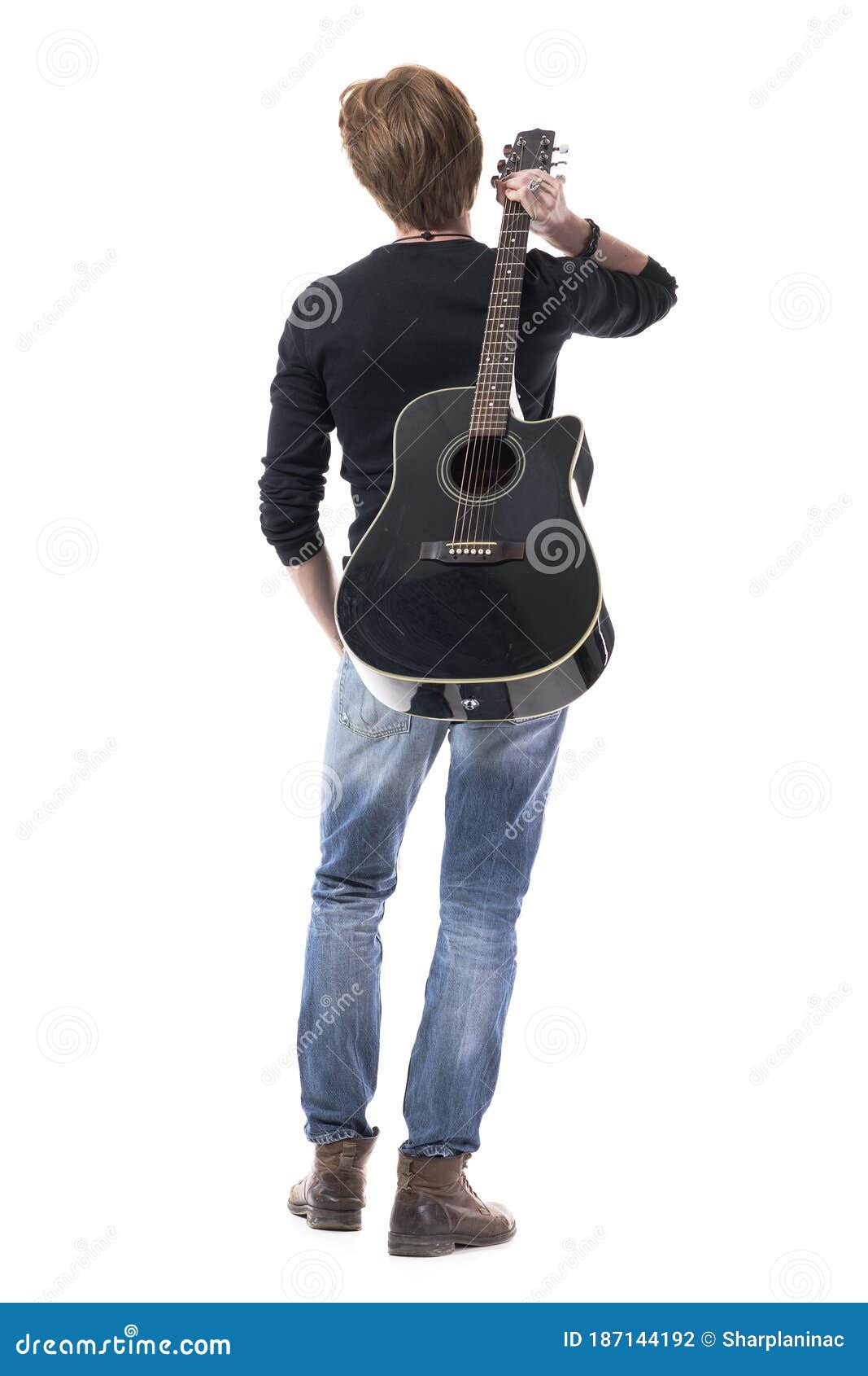 handsome rocker holding electric guitar and looking away on smoky  background Stock Photo - Alamy