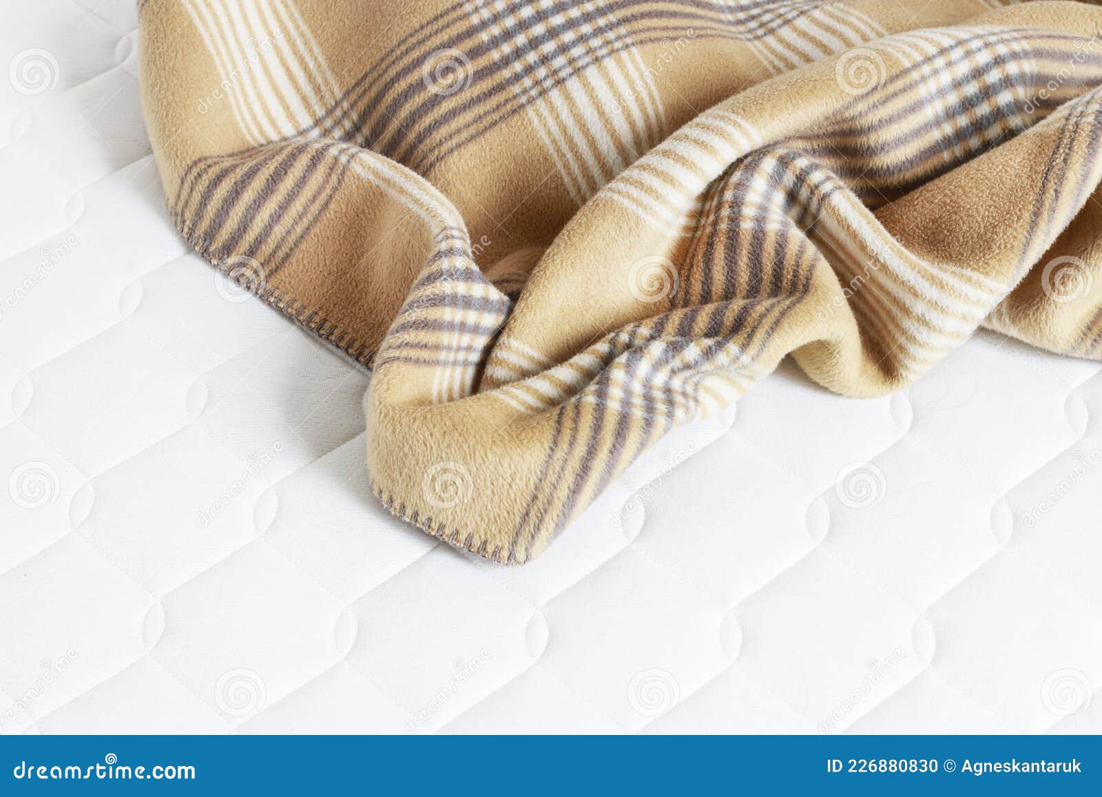 Beige blanket and bedsheet stock photo. Image of comforter 226880830