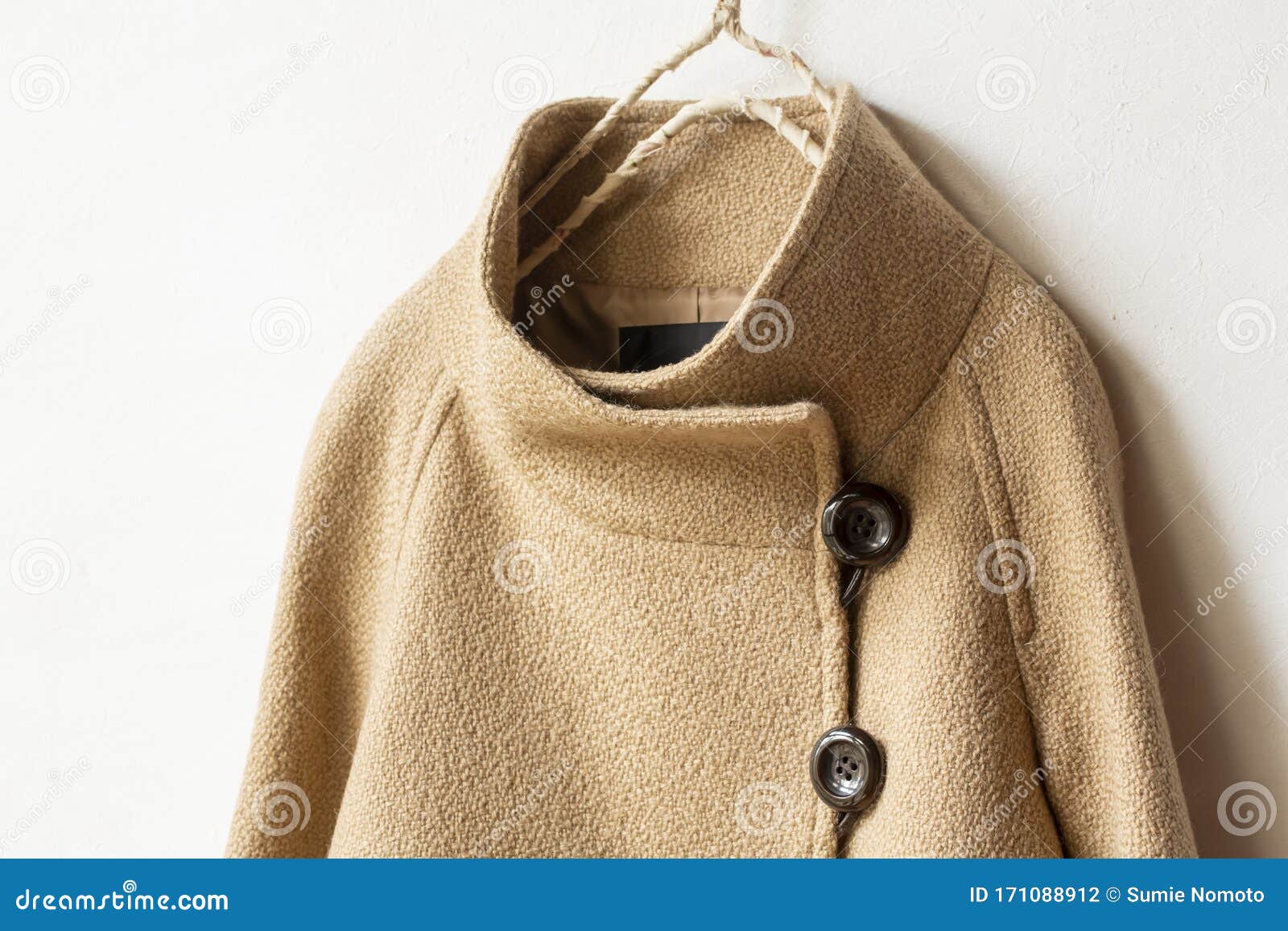 Beige Wool Coat Hanging on Clothes Hanger on White Background Stock ...