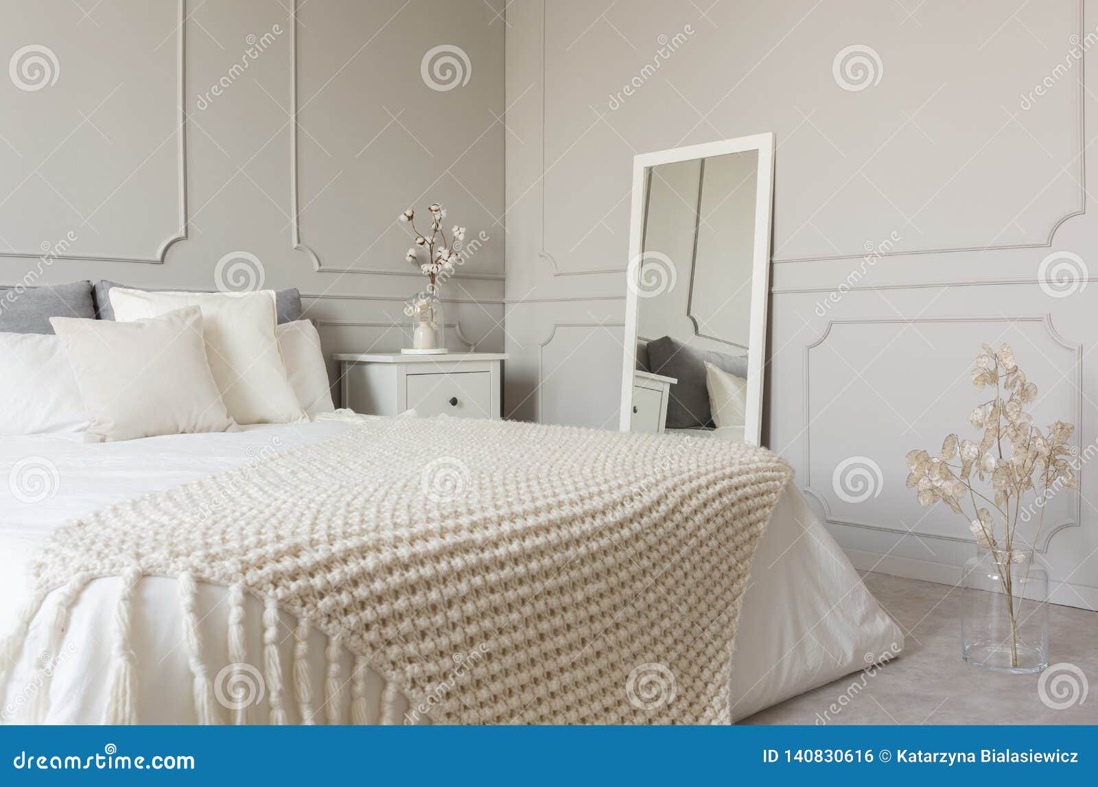 Beige Woolen Blanket On White Bedding Of King Size Bed In Fashionable Bedroom Interior With Grey Wall Stock Photo Image Of Real Bedroom 140830616
