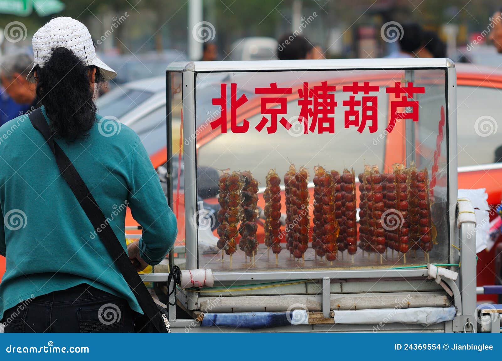 In the park, there are many small traders to do business.The picture shows a women sell BeiJing candied fruit.Xingtai City, Hebei Province, China, April 15, 2012.