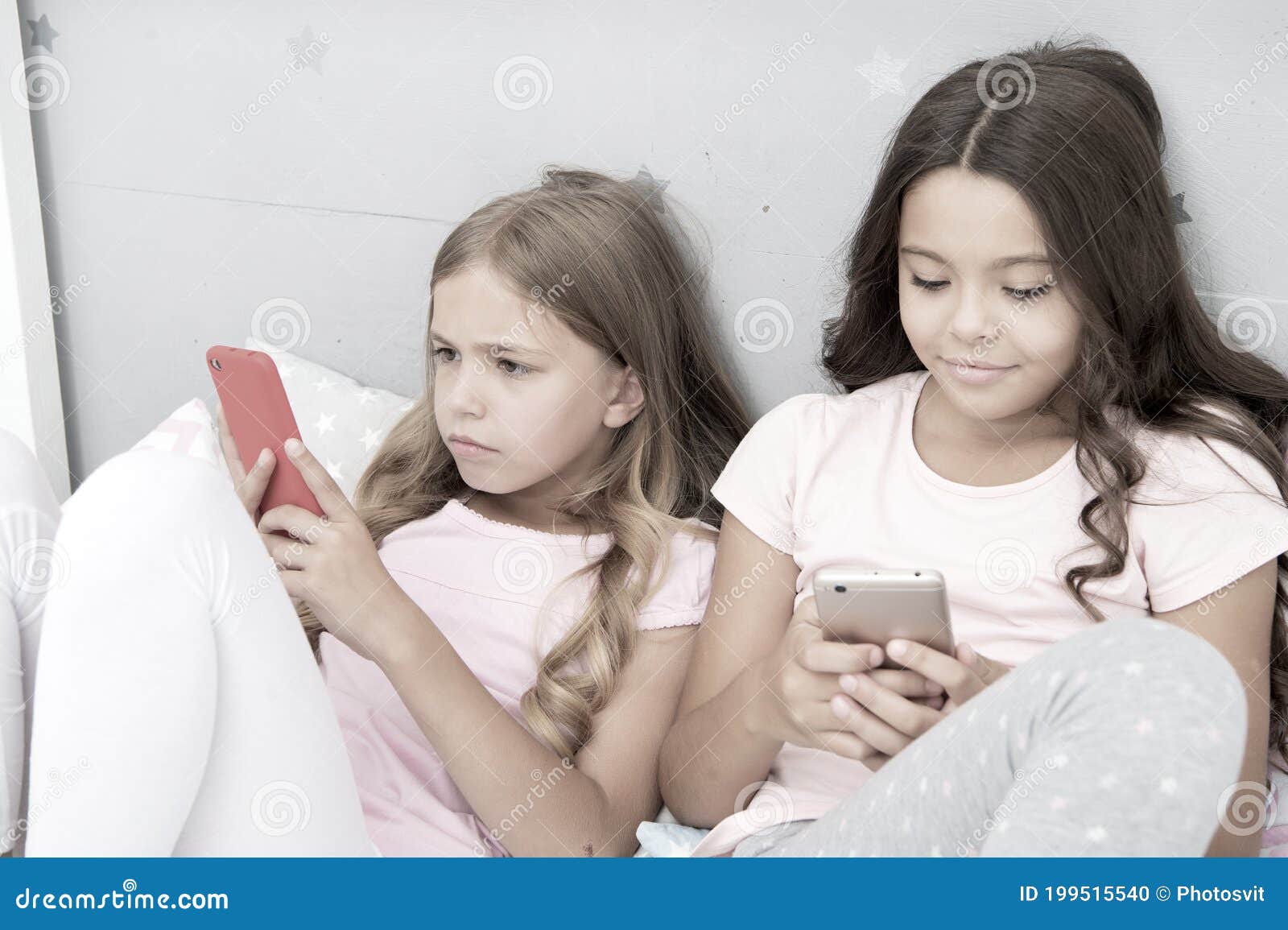 Being Online. Chatting before Sleep. Best Friends. Sisters Use Phone in ...