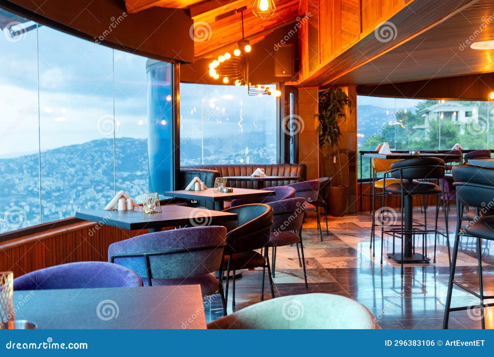 Interior Of Cozy Restaurant With Panoramic Windows Tables For Four