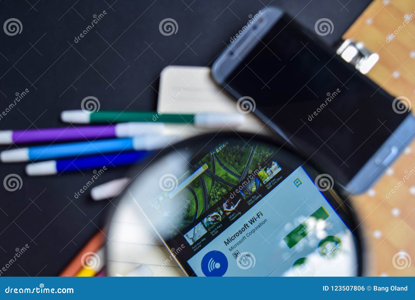 Microsoft WiFi App with Magnifying on Smartphone Screen. Editorial
