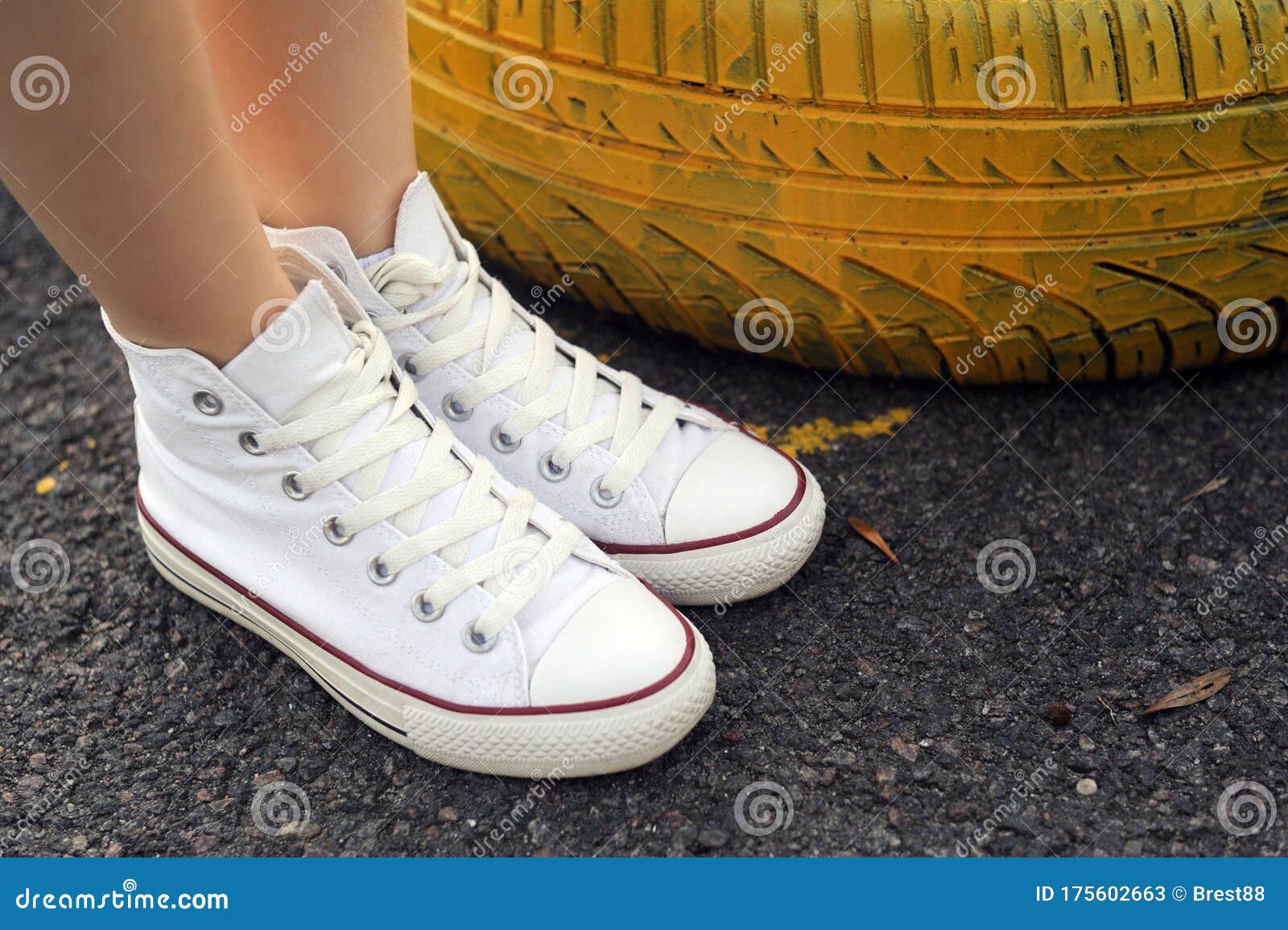 Belarus, Minsk - June 27, 2019: a Girl White Cloth Converse Sneakers Stands Old Car Tires. Stock Image - Image of footwear, side: 175602663