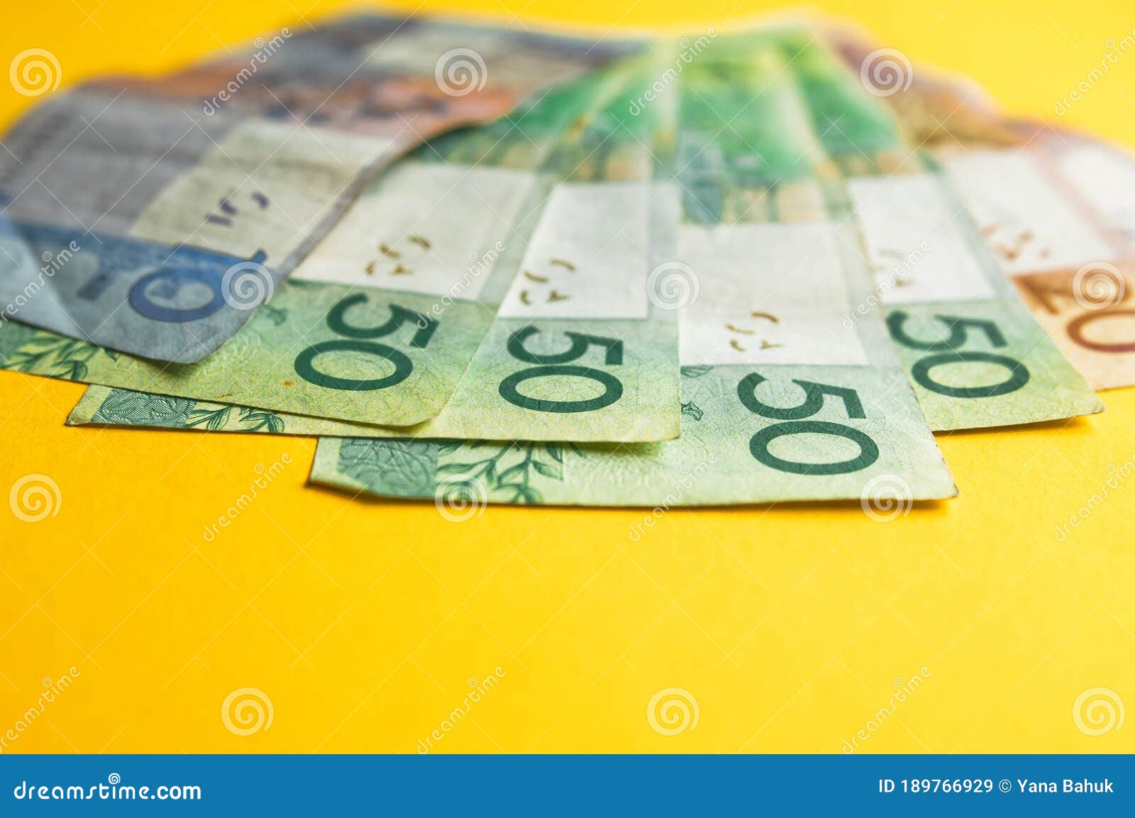 belarusian rubles and coins on a colored background