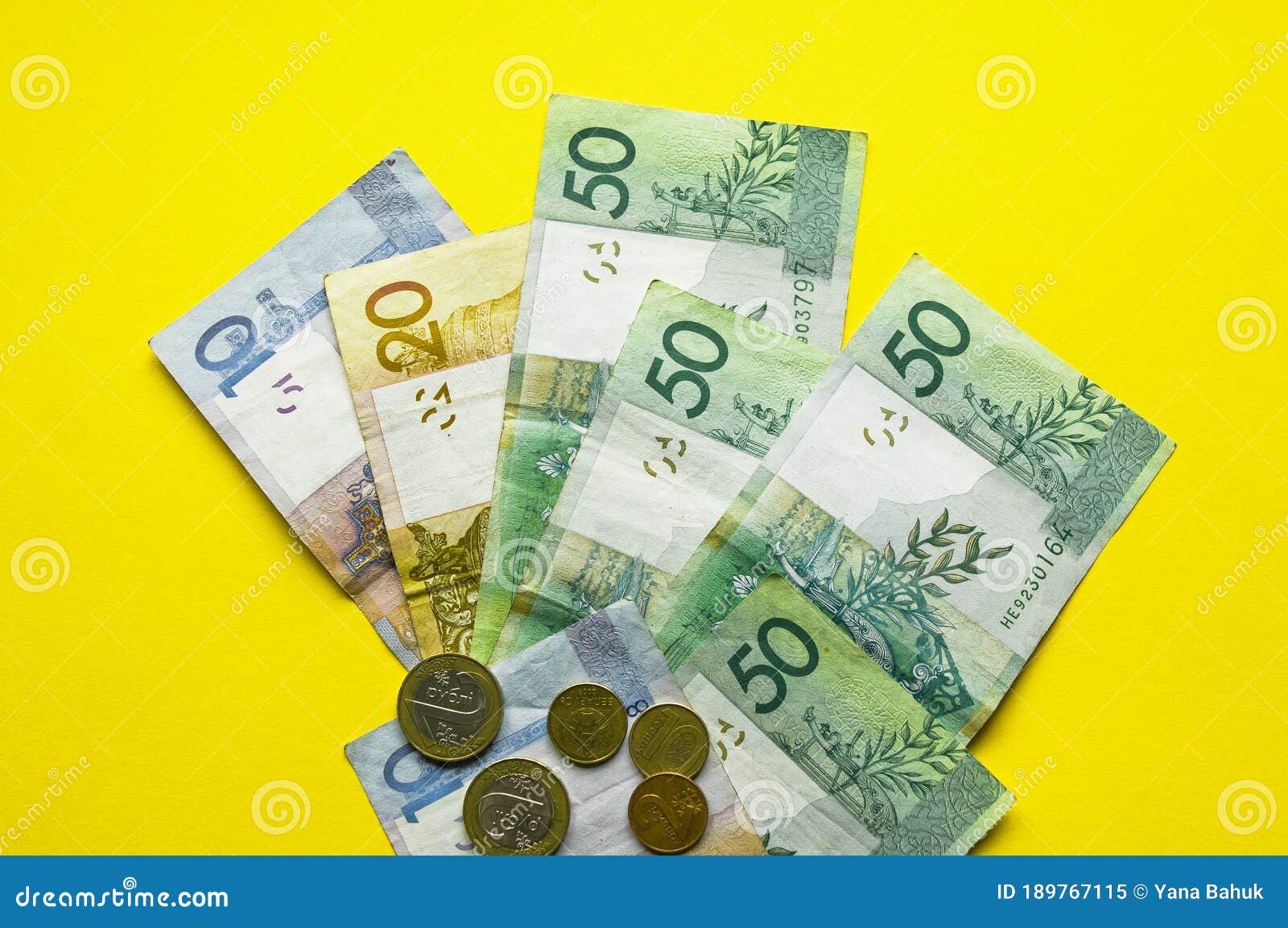 belarusian rubles and coins on a colored background