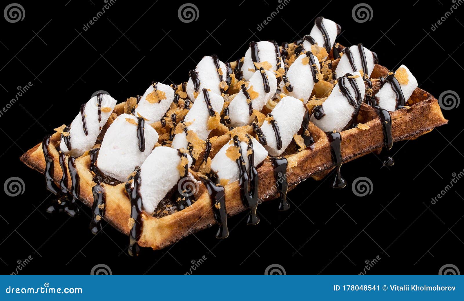 Belgian Waffle with Marshmallows and Chocolate. on Dark Background
