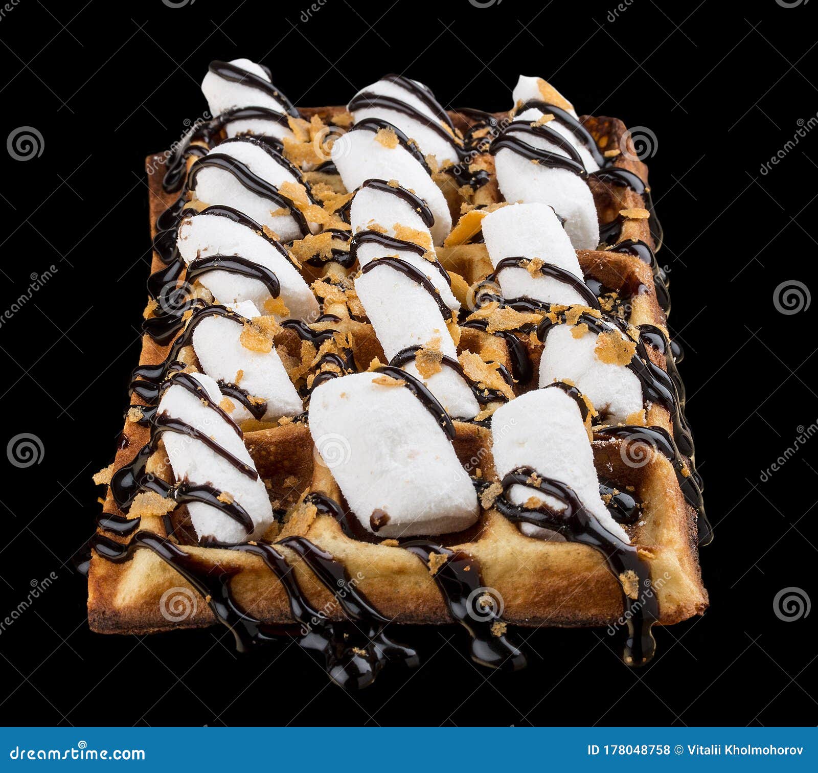 Belgian Waffle with Marshmallows and Chocolate. on Dark Background