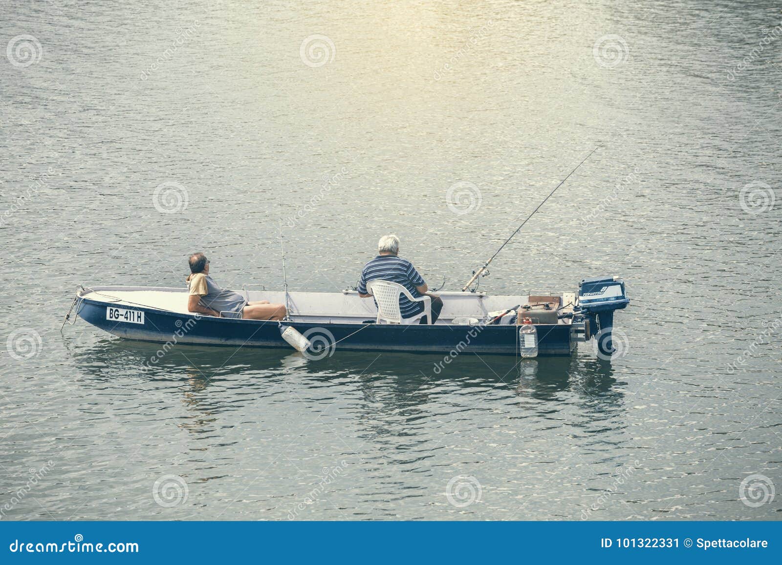 Two man fishing in a boat editorial photo. Image of activity - 101322331