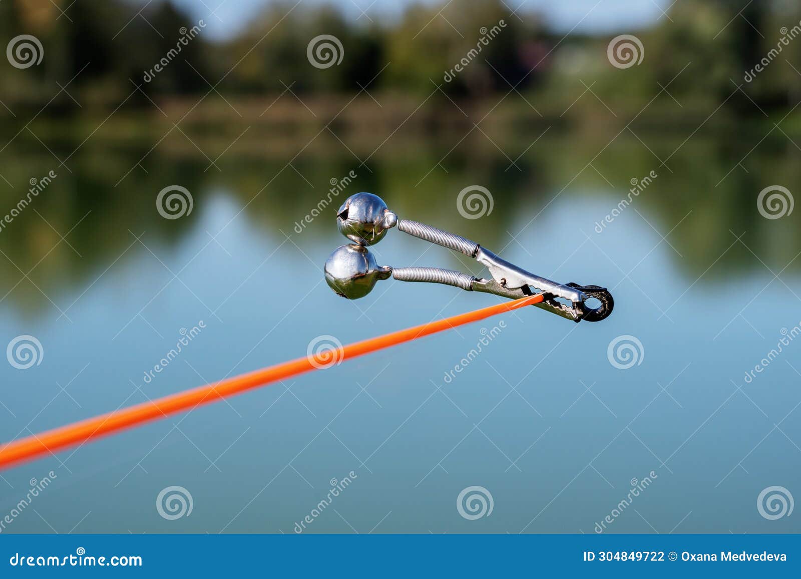 https://thumbs.dreamstime.com/z/bell-alarm-fishing-rod-spinning-nature-bells-allure-attached-to-end-abandoned-water-standing-stretched-304849722.jpg