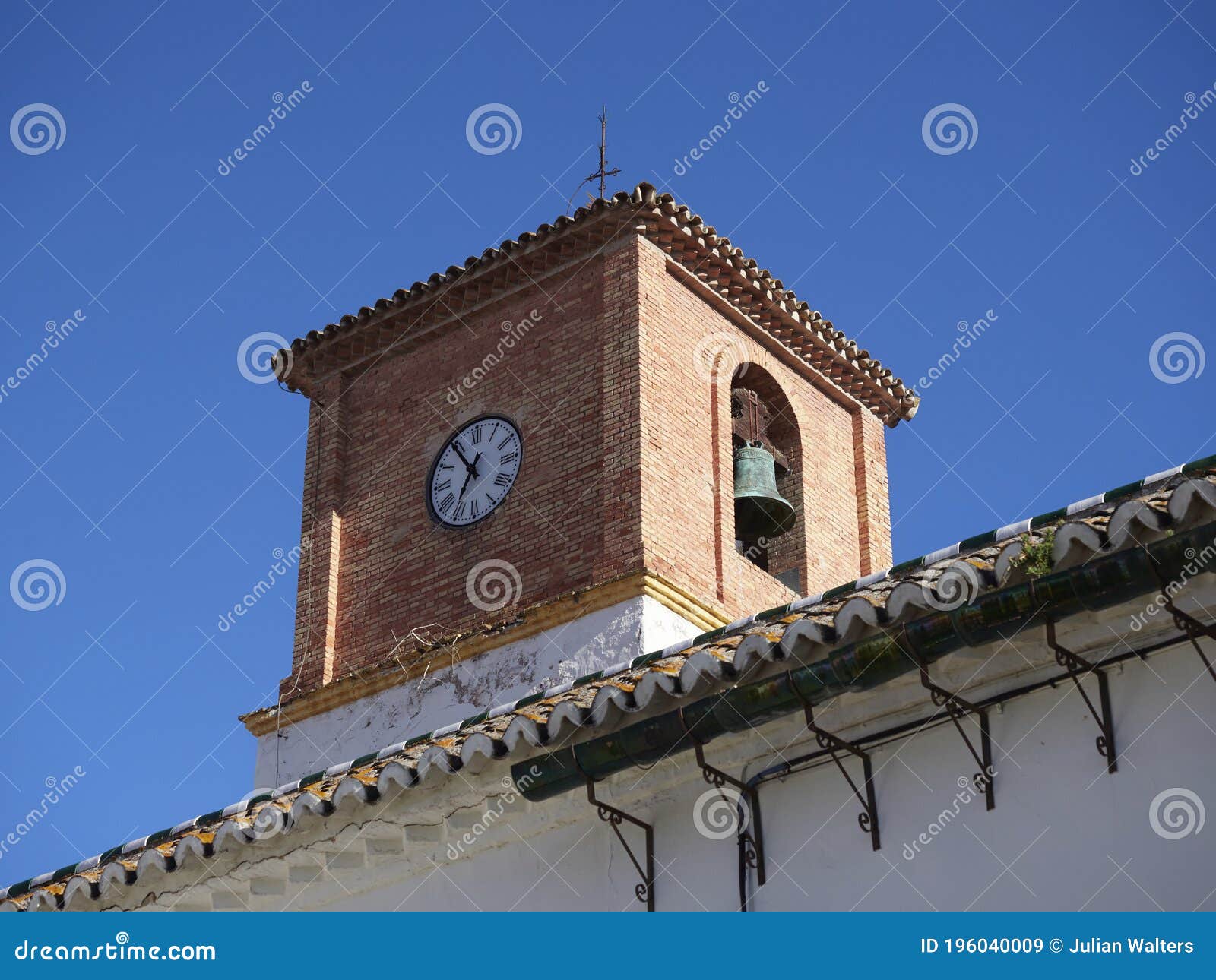 the bell and clock tower at the palacio de los condes de puerto hermoso in downtown pizarra.